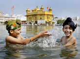 Children take a dip in the sacred pond