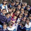 Salman Khan is all smiles posing with a bunch of school kids on the film sets
