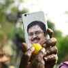Supporters of TTV Dhinakaran celebrate outside his residence as official trends indicate his lead.