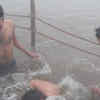 Article image for: Thousands of devotees take <i class="tbold">holy dip</i> at sangam on first day of Makar Sankranti