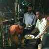 Karan Johar is distributing food to waiting reporters outside late Sridevi's residence