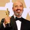 Mark Bridges winner of the Oscar for Costume Design for his work on 'Phantom Thread' pose in the press room at the Oscars.