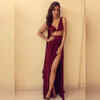 Neha channels her inner diva in a maroon thigh-high slit gown