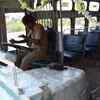 Protesters damage a bus at Egmore