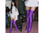 In purple Balenciaga boots