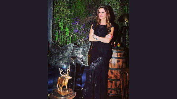 Sussanne sizzles in sheer black dress