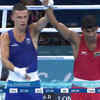 Fantastic sportsmanship by the gold medal winner Harry Garside of Australia - he raises his opponent, Manish Kaushik's hand