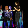 Amy Shark (woman in black) and Archie Roach perform as they start the ceremony a while back