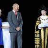 President of the CWG Federation Louise Martin (L) and Mayor of the Gold Coast Tom Tate (C) pass the Commonwealth Games flag to Lord Mayor of Birmingham Anne Underwood