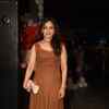 A socialite poses with delight