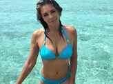 Bikini-clad Liz Hurley sets temperature soaring with her age-defying pictures
