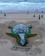 Sand artist creates world's biggest sand turtle with plastic
