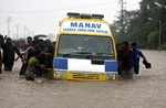Ambulance has a tough time through waterlogged Vasai