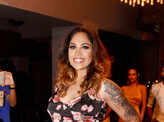 Socialites attend an event to enhance an evening party look
