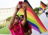 Parmesh Shahani and Nitasha Biswas attend a pride parade