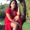 Sumona Chakravarti sports a red outfit with a thigh-high slit; looks her hottest best