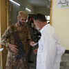 A soldier checks a voter's information at a polling station in Islamabad.