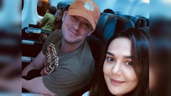 Photo: Preity Zinta and Gene Goodenough are all smiles as they head back home