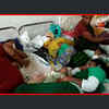 Article image for: Overburdened: Three mothers with their new-born babies share single bed at a government hospital in Visakhapatnam