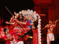 Artistes perform at a grand show to mark Durga Puja celebrations