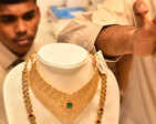Gold loses sheen, down Rs 80 on weak trend overseas