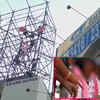 Article image for: On cam: TRS leader injures self with brick; supporters climb a tower in protest