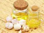 What makes garlic oil good for skin and health?