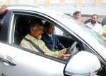 Chandrababu Naidu tries driving an electric car