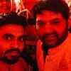 Kapil poses with a friend