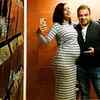 Flaunting baby bump in a dress