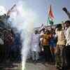 People celebrate on the streets of Bhopal
