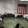 Union minister Shripad Naik and other VIPs wait in Kala Academy waiting room after paying last respects to Parrikar