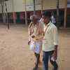 A student volunteer helping a senior citizen to cast his vote at Paduvalahippe polling booth in Hassan, Karnataka