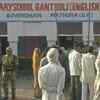 Mathura: People queue up outside booth number number 46 in Gantholi village of Govardhan block. The voting is yet to begin here due to EVM malfunction.
