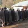 Jammu & Kashmir: People queue up outside a polling booth number in Ganderbal district of Srinagar Parliamentary constituency, to cast their votes.