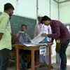 Preparations under way for polling to begin at a booth in Assam