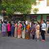Voters queue up early at a booth in Rajkot