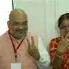 BJP President Amit Shah and his wife Sonal Shah cast their votes at polling booth in Naranpura Sub-Zonal office in Ahmedabad