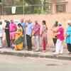 Voters queue outside polling booth number 40 & 41 in South Mumbai parliamentary constituency