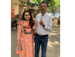 Milind Narvekar seen with his wife after voting