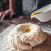 Cover the dough surface with oil/ghee