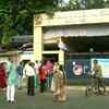 People queue up outside polling station no. 152/41 and 152/47 in South Kolkata to cast their votes