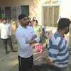 Cricketer Harbhajan Singh waits in queue to cast his vote at a polling booth in Jalandhar's Garhi village
