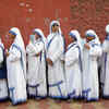 Catholic nuns from the Missionaries of Charity stand in a queue as they wait to cast their vote at a polling station during the final phase of general election in Kolkata