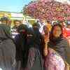 Voter brought umbrellas with them to provide shade for Muslim women voters who were fasting