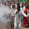 Supporters of YSR Congress party celebrate outside the house of the party leader Jaganmohan Reddy after learning initial poll results, in Hyderabad. (Photo credit: REUTERS)