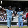 Ben Stokes raises his bat after completing half-century
