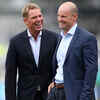 Warne shares a laugh with former England skipper Strauss