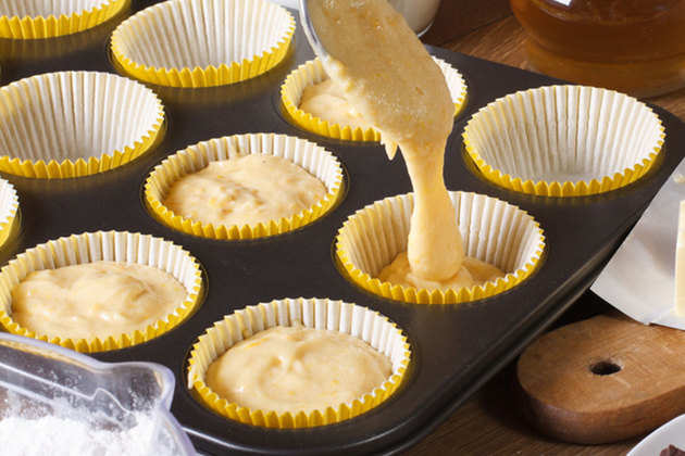 pouring-cake-batter-in-muffin-cup