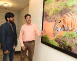 Wildlife photography enthusiasts​ attend a Tiger photo exhibition